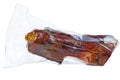 Leg of cured pork in plastic vacuum package Prshut remains