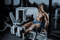 Leg Exercises - Man Doing Leg With Machine In Gym