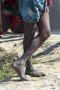 Leg of a labourer with mud all over it working on the fish pond fishing Royalty Free Stock Photo