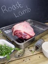 Leg of lamb with ingredients and blackboard Royalty Free Stock Photo