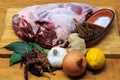 Leg of lamb with marinade ingredients Royalty Free Stock Photo