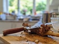 Leg of lamb roasted meat with a carving knife on a board