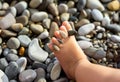 Leg of little child at sea beach