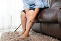 Leg pain of senior woman at home, healthcare problem of senior concept Royalty Free Stock Photo