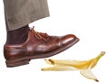 Leg in the right brown shoe slips on a banana peel Royalty Free Stock Photo