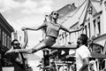 Leg split of young woman standing in street training sport Royalty Free Stock Photo