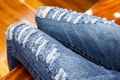 Leg of women in fragmentary and torn jeans