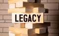 LEGACY concept, wooden word block on grey background Royalty Free Stock Photo