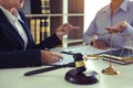 Legal advisor is explaining the offense under the law in the book at office Royalty Free Stock Photo