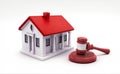 Legal auction and real estate, with a symbolic gavel and miniature house, represent the intersection of law, property, taxes, and