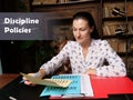 Legal concept about Discipline Policies Female office workers with yellow shirt holding and writing documents on office desk