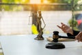 Legal concept judge`s hammer Statue and scales of justice old courtroom library, wooden table, goddess of justice Notarized attorn Royalty Free Stock Photo