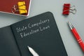 Legal concept meaning State Compulsory Education Laws with sign on the sheet