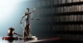 Legal Concept: Themis is the goddess of justice and the judge's gavel hammer as a symbol of law and order on the