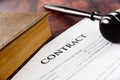 Legal contracts are subject to commercial disputes resolved in the courts of justice, contract with gavel