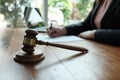 Legal counsel presents to the client a signed contract with gavel and legal law. Royalty Free Stock Photo