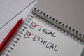 Legal and Ethical write on a sticky note. Supported by an additional services isolated wooden table Royalty Free Stock Photo
