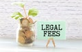 LEGAL FEES text on notebook with pen on a chart background Royalty Free Stock Photo