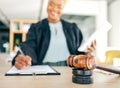 Legal, gavel and judge writing for an investigation document, contract or criminal case in a law firm. Court hammer Royalty Free Stock Photo