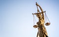 Legal law concept statue of Lady Justice with scales of justice sky background Royalty Free Stock Photo