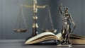 Legal and law concept statue of Lady Justice on the table with book and scale Royalty Free Stock Photo