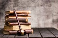 Legal Law and Justice concept - Old law book with a wooden judges gavel on table in a courtroom or law enforcement Royalty Free Stock Photo