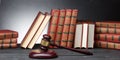 Legal Law and Justice concept - Open law book with a wooden judges gavel on table in a courtroom or law enforcement Royalty Free Stock Photo