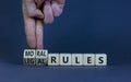 Legal or moral rules symbol. Businessman turns wooden cubes and changes words `legal rules` to `moral rules` on a beautiful gr