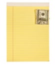 One hundred dollar bill paper clipped to yellow lined paper