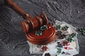 Legal Rules For Online Gambling Concept. Wooden Gavel, Money Banknotes And Playing Cards On Grey Background