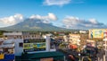 LEGAZPI, PHILIPPINES - JANUARY 5, 2018: - Mount Mayon volcano looms over the city as daily life goes on.