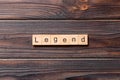 Legend word written on wood block. legend text on cement table for your desing, concept