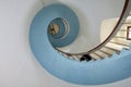 Legendary design spiral staircase interior. White and blue collor