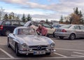 Legendary Gullwing Mercedes 300 SL sportcars to a road parking