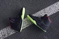 Legendary Nike Air Yeezy 2 sport shoes shot outdoor on asphalt road line. Krasnoyarsk, Russia - December 12, 2017