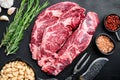 Legendary Ribeye fresh raw beef steak with spices and white beans, on black stone background, top view flat lay Royalty Free Stock Photo