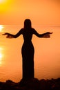 Woman at vacation at sunset, tourism concept