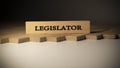 Legislator written on wooden surface. Law and politics Royalty Free Stock Photo