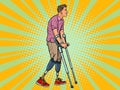 Legless veteran with a bionic prosthesis with crutches. a disabled man learns to walk after an injury. rehabilitation