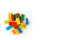 Lego background. Bunch of Colorful Plastick constructor cubes on white background. Popular toys. Copyspace