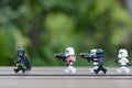 lego batman running from lego storm trooper.