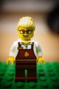 Lego brand toy woman retail worker figurine