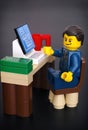 Lego businessman at his working table