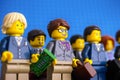 Lego businesswoman and businessman minifigures standing in rows