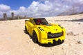 Lego Chevrolet Corvette Z06 with driver on sandy road