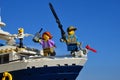 LEGO City boy and a woman during holiday on front of small yacht