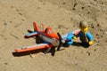 LEGO City figure of boy adding oil to propeller of die cast Mattel model of Dusty Crophopper airplane