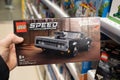 Lego constructor Fast Furious, 1970 Dodge Charger R T in hand of buyer in a Lego store. Minsk, Belarus, 2023