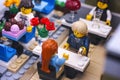 Lego couple in Restaurant. Man gets ready to propose with gold ring