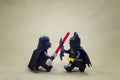 Lego darth vader fighting batman.